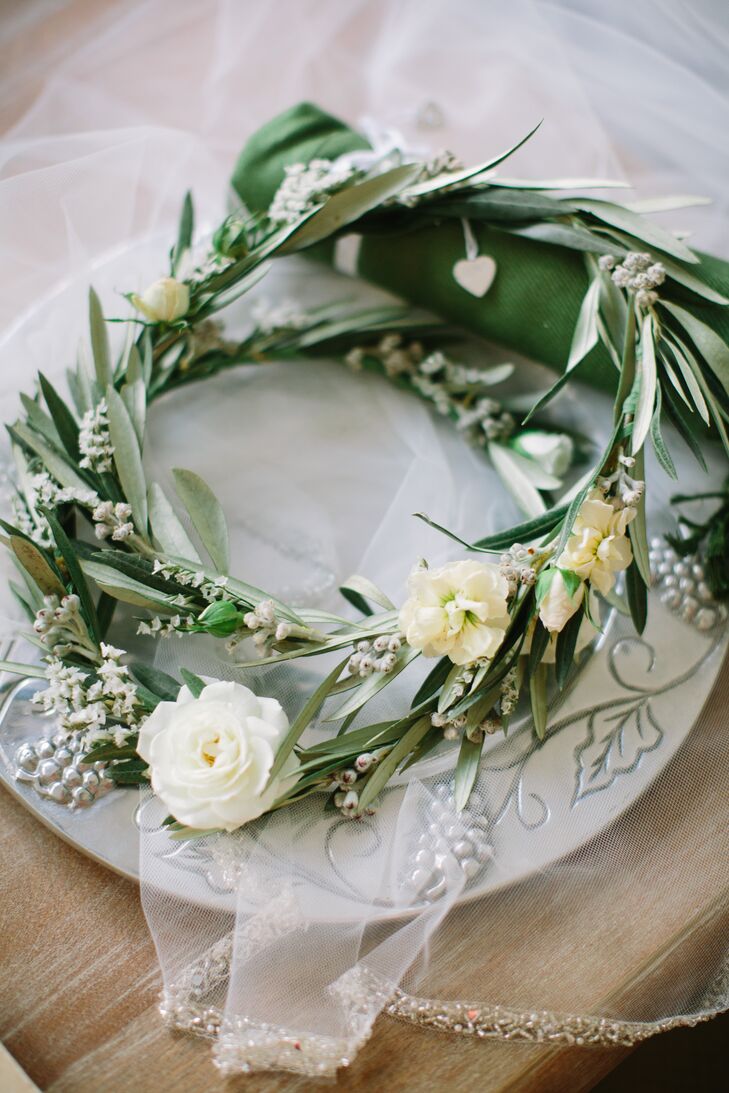 During the reception, Sloane wore an olive branch and rose floral crown in her half-up hairstyle.