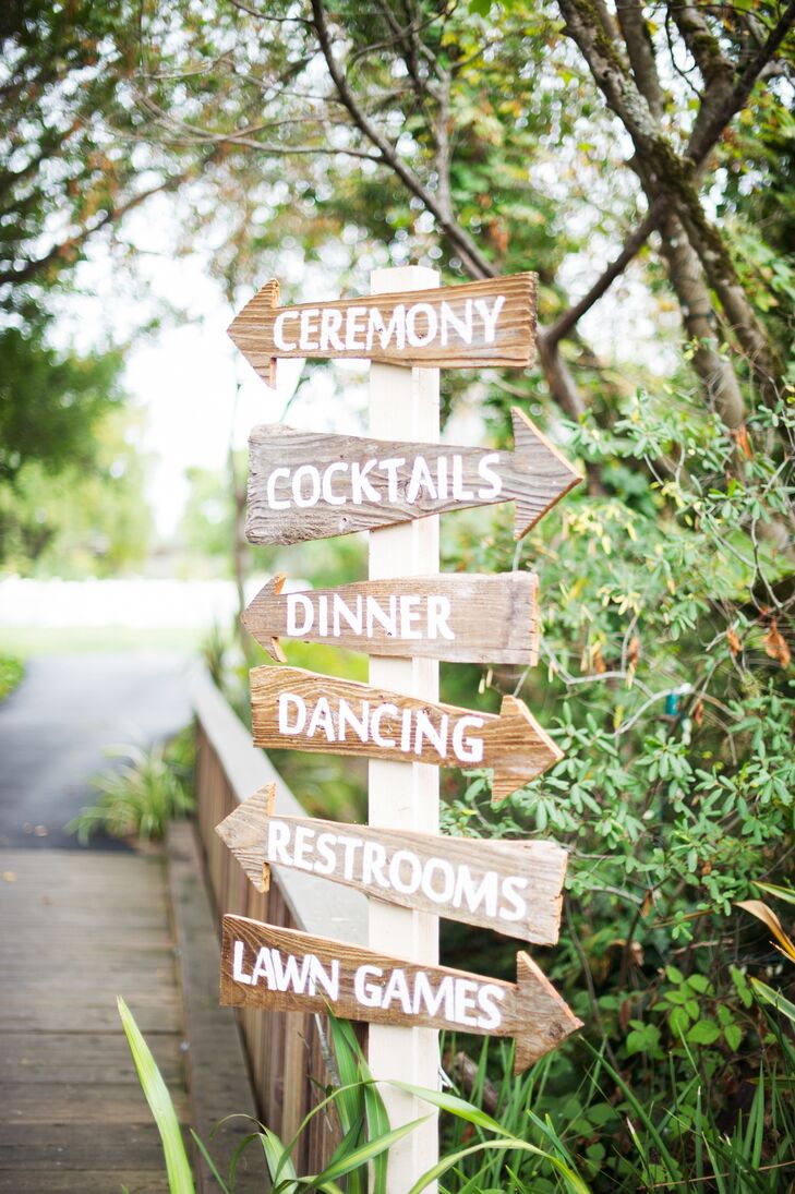 Danielle handcrafted many elements of the wedding, including this sign post that helped guide guests around the sprawling property.