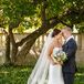 Jackie and Bryan embraced in happiness as they saw each other in their wedding attire for the first time. They both sported a very classic look—Jackie in a white silk strapless dress and Bryan in a charcoal gray suit with a black tie.