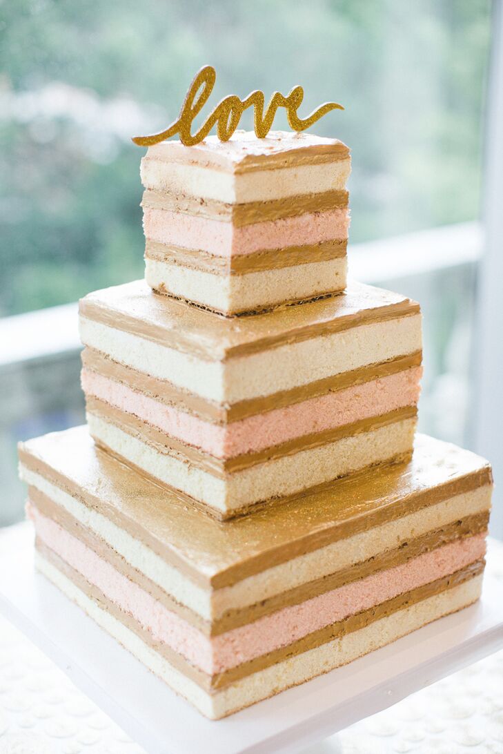 The bride won her wedding cake through the Carolina Bride "Dream Wedding Cake Giveaway" by submitting an essay describing the wedding cake of her dreams. Ines from Sky's the Limit Cakes created the sweet treat while a gold glitter cake topper completed the simple feel of the naked cake.