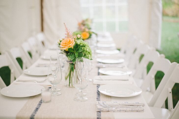 "The color palette was very soft.  The flowers were a mix of white, cream, peach, light green and pale pink," says Emily. "My mom made linen runners for the tables as well as blue and white floral napkins."
