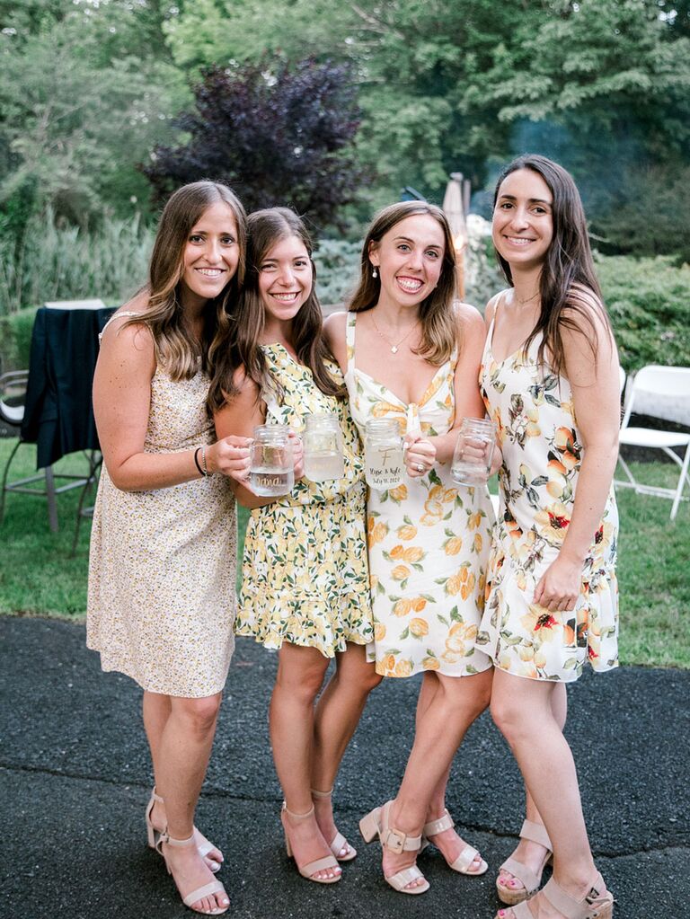 Wedding guests in sundresses at outdoor summer wedding