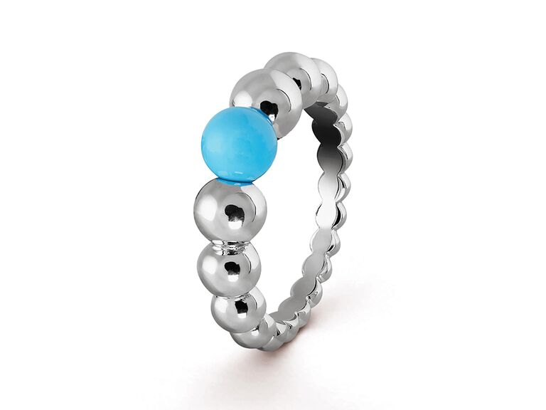 White gold beaded band with one turquoise bead in center