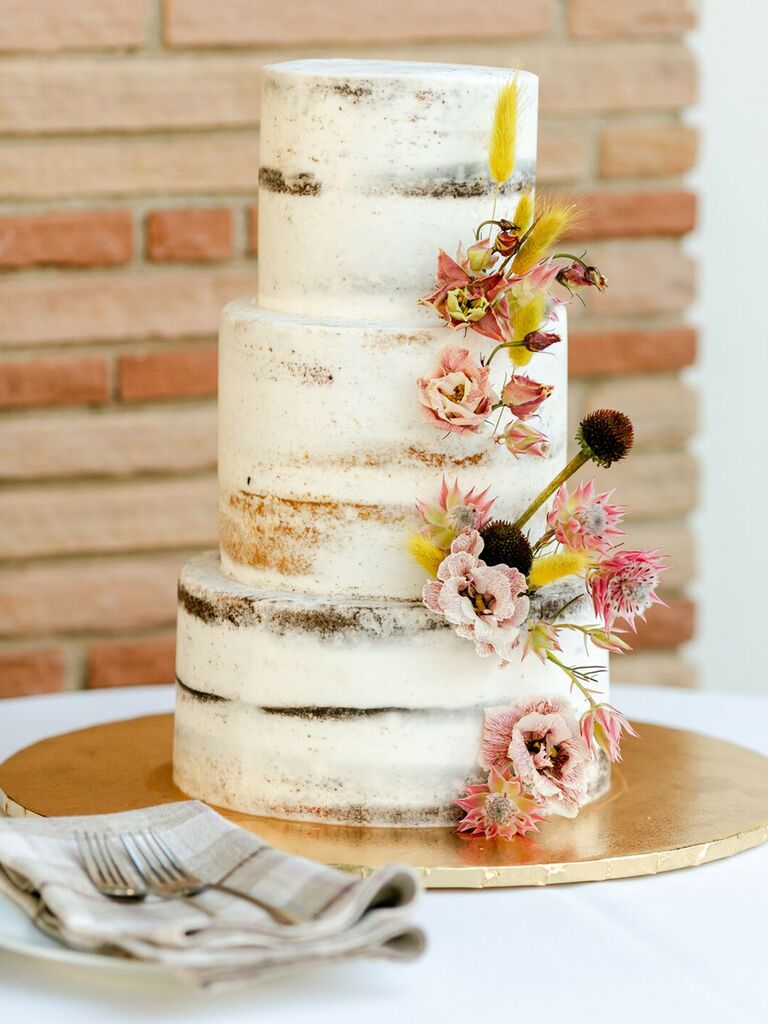 naked wedding cake with dried flowers