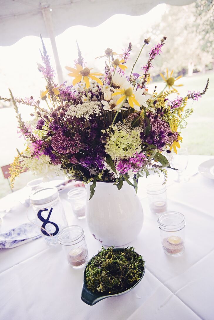 Remaining true to their outdoor picnic vibe theme, Neil and Alana chose wildflowers, candle lit mason jars, moss bowls and strung lights to decorate.
