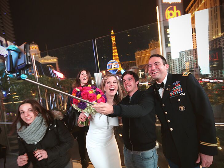 Brianna Keilar and Fernando Lujan pose for a selfie with Las Vegas tourists