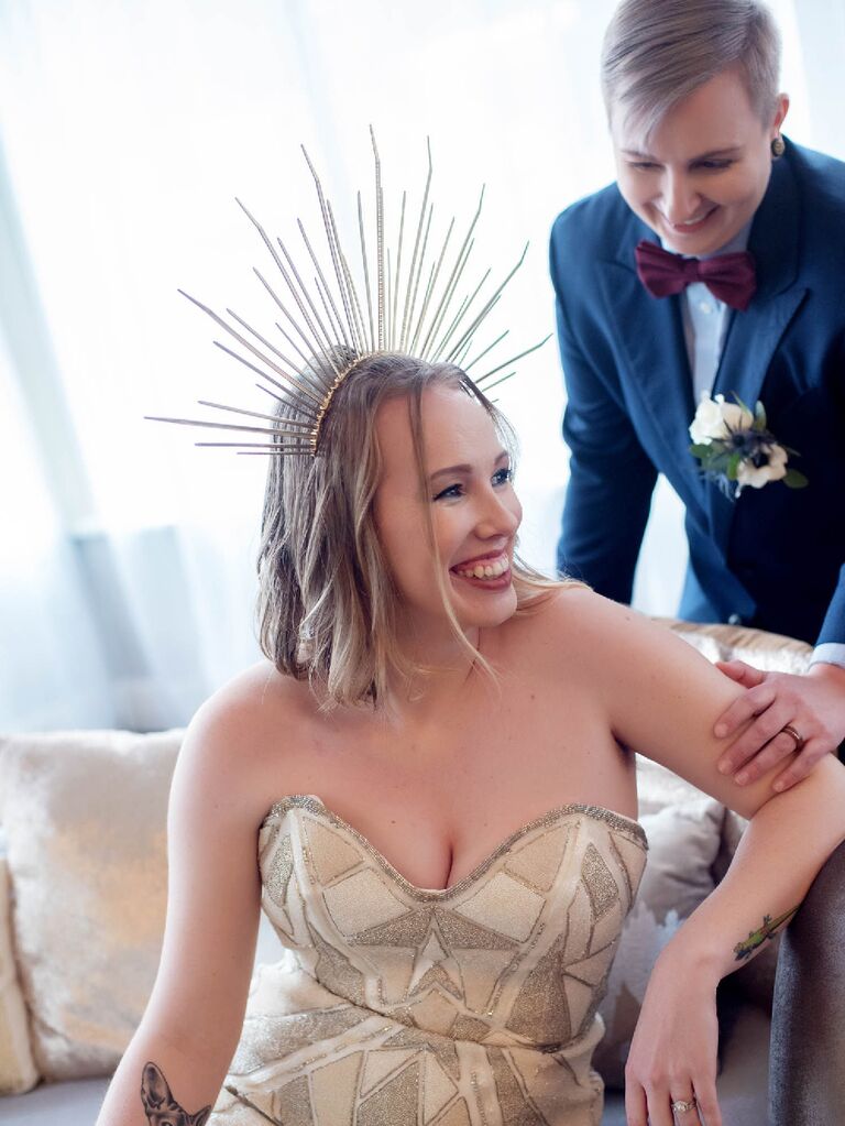 Bride wearing strapless wedding dress with celestial sunburst headpiece