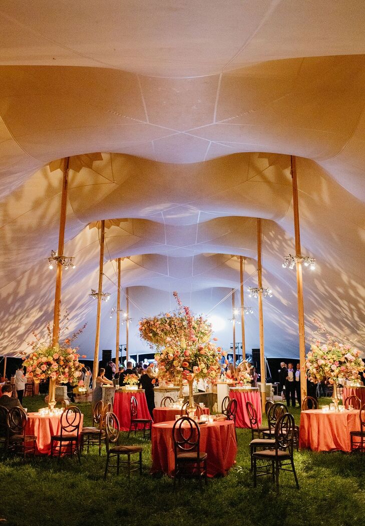 Tented Reception With Uplighting and Orange Table Linens