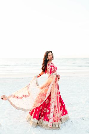 Bride Twirls Pink Sari on the Beach