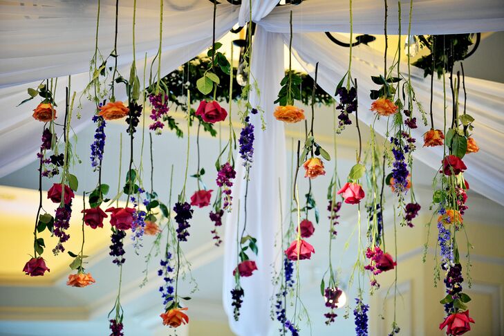 A fan of bright colors, Ashley knew she wanted the wedding to feature a spectrum of vibrant hues. The couple decided on a palette of pink, orange, purple, blue and subtle pops of green, infusing energy and life into the elegant Wharf Room at the Boston Harbor Hotel.