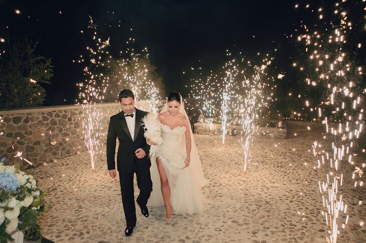 The newlyweds made a grand ceremony exit with fireworks lighting the way.