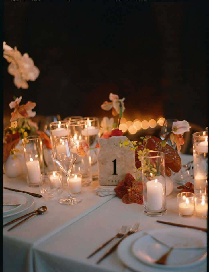 Reception Place Setting With Lots of Low Candles, Elegant Table Number, Orchids and Low Light