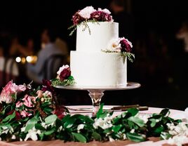 classic simple white wedding cake with red and white flowers
