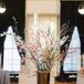 Black-and-White Striped Escort Card Table with Cherry Blossoms Arrangement