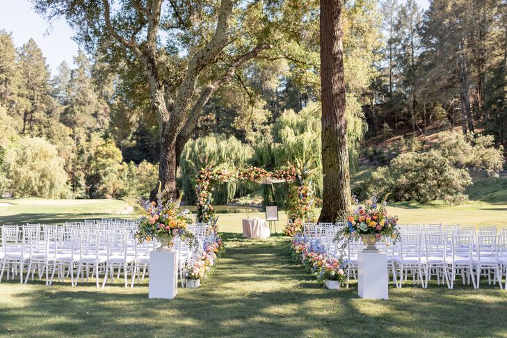 Natural Ceremony Site with Arch and Flower Arrangements at Meadowood in St. Helena, California