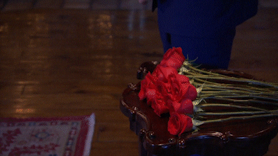 The Bachelor Clayton holding a rose