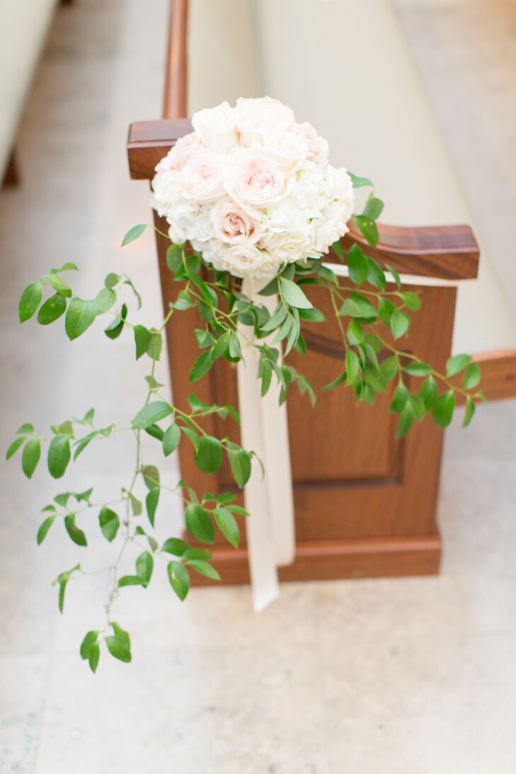 Playing off the secret garden theme, Megan and Bobby transformed Prestonwood Baptist Church into a botanical dream. Bundles of fresh ivory and blush roses trimmed with cascading vines adorned each aisle, while the altar was decorated with two lavish arrangements of ivory roses and hydrangeas.