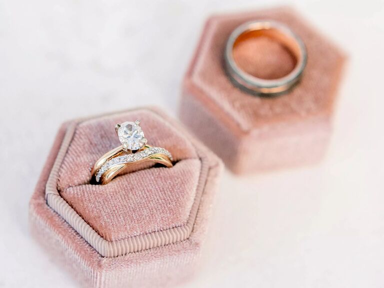 Oval solitaire engagement ring and wedding band in pink box