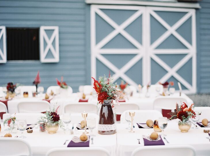 “I wanted the reception to have unity in colors and themes, but not look uniform—more like an organic setting of flowers,” Shelby says. The reception’s family-style tables were filled with low and tall centerpieces of dahlias, astilbes, magnolia leaves, greenery and wildflowers all in their favorite burgundy, red and green hues. Arrangements from 2Birds Events also helped to bring in the day’s fall feel.