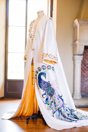 A Groom's Custom-Made White-and-Gold Wedding Cape With Peacock Detailing