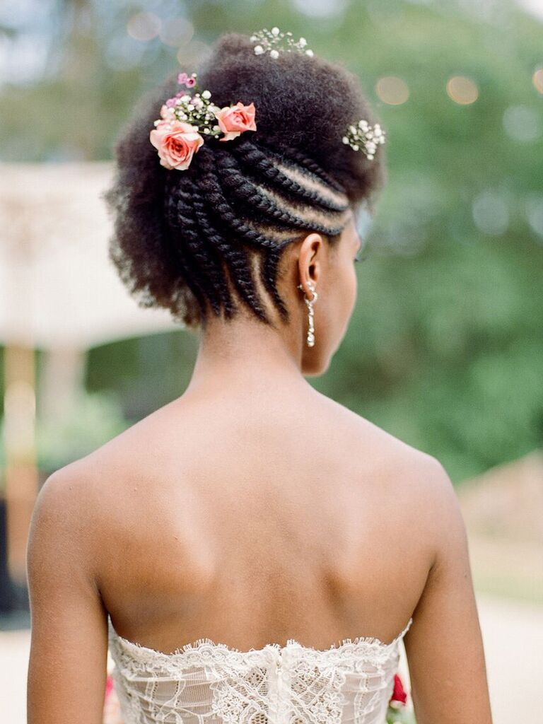 beach wedding hairstyles reverse braided updo with flowers on top