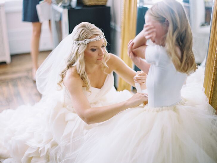 “I wasn’t planning on wearing a veil for the ceremony, but I am so glad I did,” says Jamie. “It complemented my entire look and made me feel like a bride.” She also incorporated a belt that she transformed into a bohemian headpiece for extra sparkle.