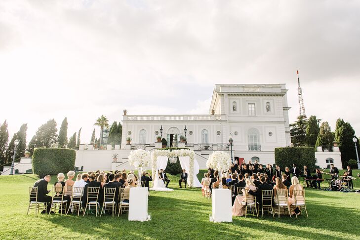 The ceremony unfolded outdoors in Villa Miani’s beautifully manicured English garden. “We have always wanted a ceremony outside, and this spot fit us perfectly,” Silje says. “To complement the gorgeous white villa, we wanted all the flowers to be white and the rest of the decor to be gold.”