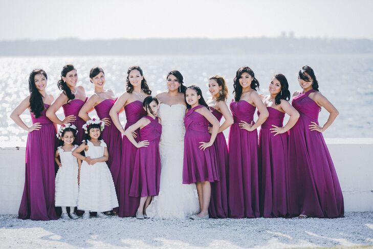 Jessica dressed her bridesmaids in fuchsia strapless gowns to add some bold color to the venue's white backdrop.
