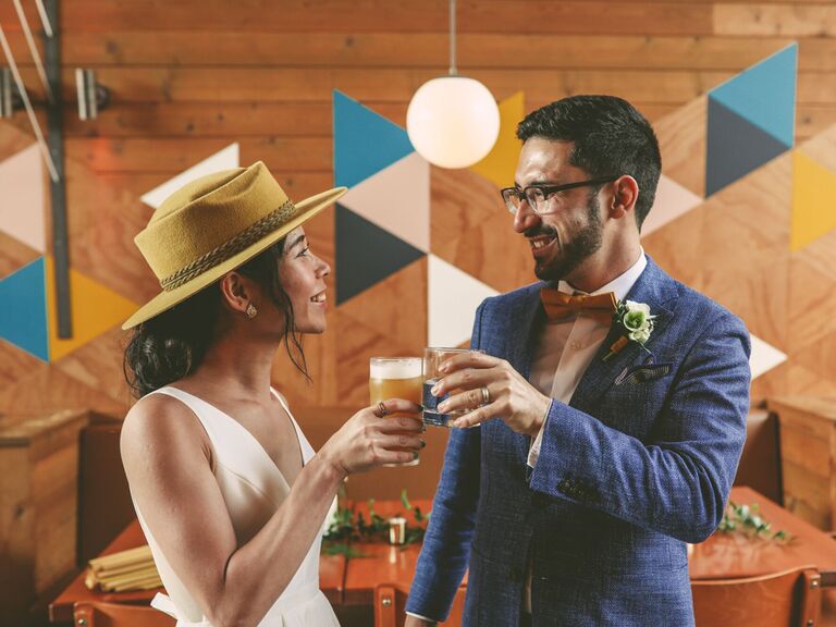 Bride and groom cheers on wedding day