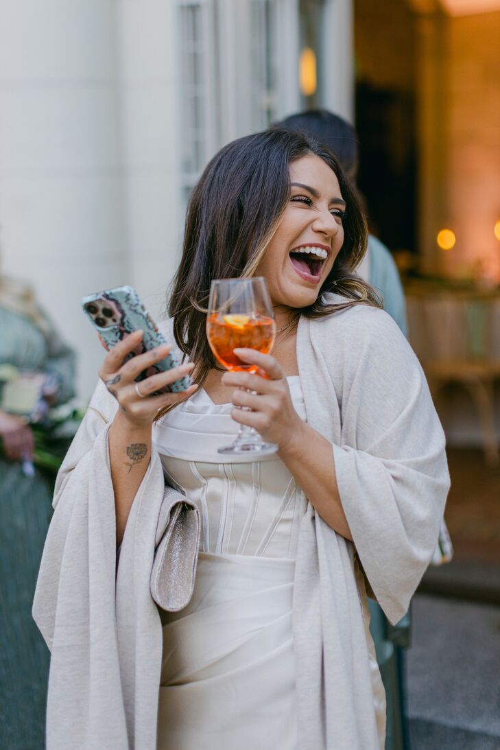 Guest With Refreshing Cocktail in Light Taupe, Fashionable Dress