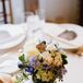 Though Kim and Justin now call New York City home, the pair knew a Big Apple wedding just wasn’t there style. With Justin hailing from a farm in Pennsylvania and Kim from Massachusetts, a New England wedding with plenty of rustic flair seemed like the perfect fit. The Barn at Gibbet Hill in Groton, Mass. provided a beautiful backdrop for the affair, exuding plenty of country charm with its post and beam structure and surrounding natural landscape.