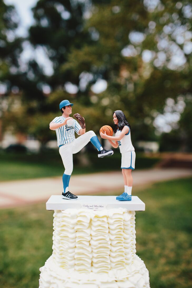 “Our wedding cake topper was personalized to look like us and was made to look like an action shot from our sports in our athletic jerseys,” says the couple.