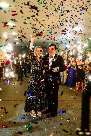 Couple Exited Wedding Reception Amid Cascade of Colorful Foil Confetti