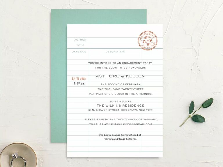 Lined blue and white engagement party invitations inspired by a library card