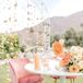 Whimsical Sweetheart Table with Pink Lounge Chairs and Candles