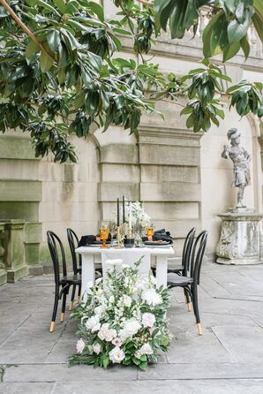 Reception Table With Black Bentwood Chairs and Black Taper Candles