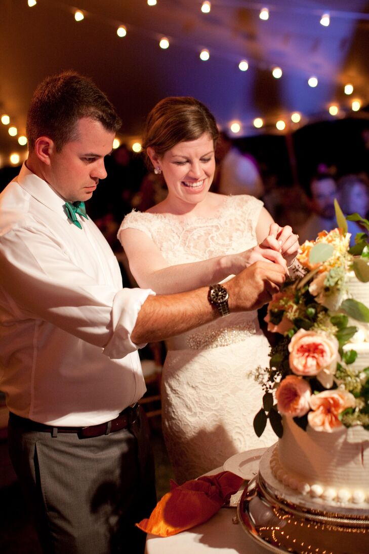 The couple cut into their strawberry and vanilla wedding cake during the high point of their reception.