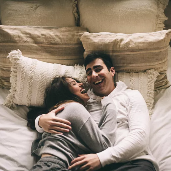 Sweet and candid engagement photoshoot in bed