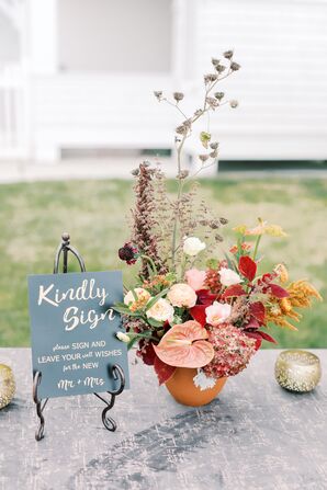Guest Book Table With Bohemian Flower Arrangement