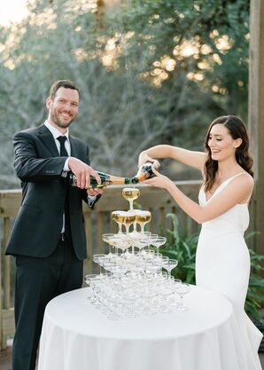 Couple Pouring Champagne for Reception Champagne Tower