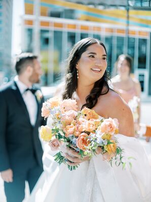 Bride With Natural Makeup, Drop Earrings and Pastel Flower Bouquet