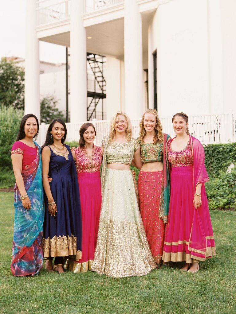Bridesmaids in different colorful Indian wedding attire. 