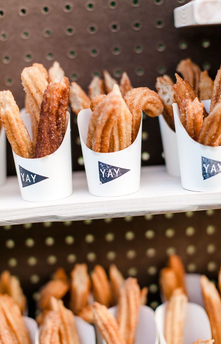 Mini servings of churros at a bridal shower. 