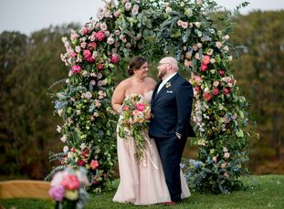 A rustic-meets-elegant barn set the scene for Megan Fortney (27 and a marketing manager) and Benjamin Smith’s (26 and a student) flower-filled affair 