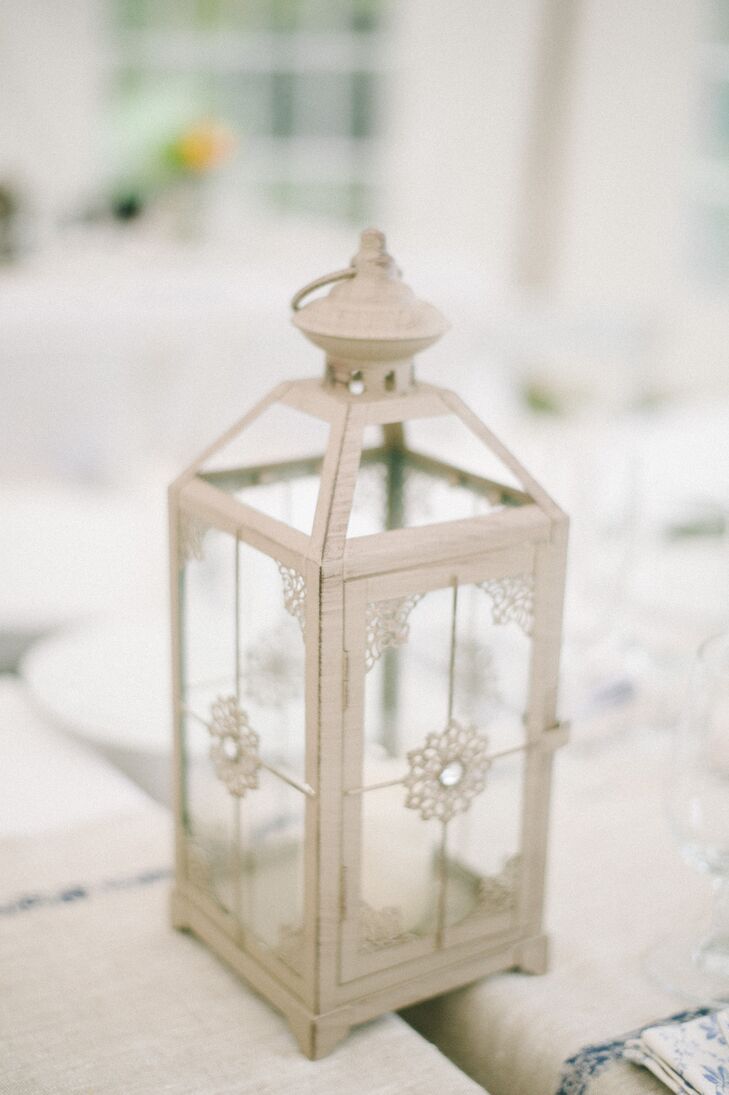 Apart from romantic arrangements of peach flowers at the reception tables, centerpieces were also made of vintage-inspired lanterns and candles.