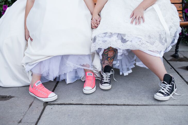 Nicole and Morgan wore pink and black Converse shoes, adding a whimsical touch to their bridal styles.