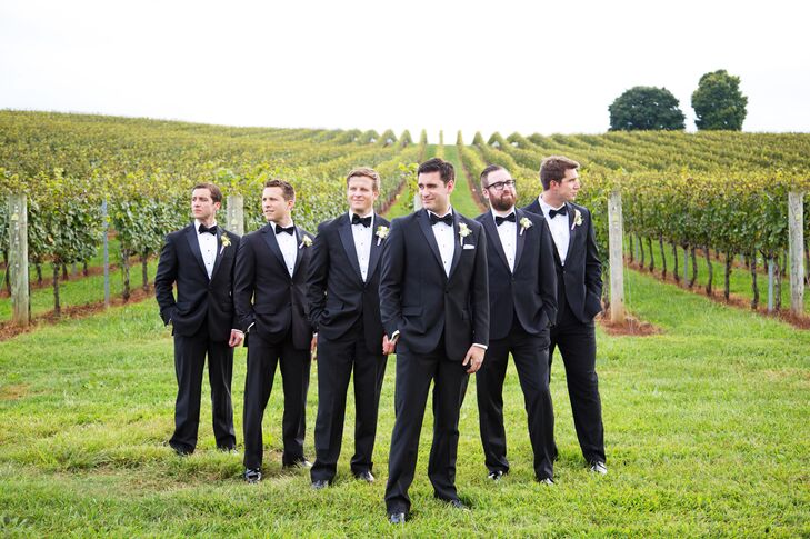 Groom and groomsmen wore classic black tuxedos.