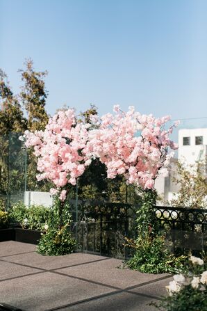 Rooftop Ceremony Arch with Cherry Blossoms and Greenery
