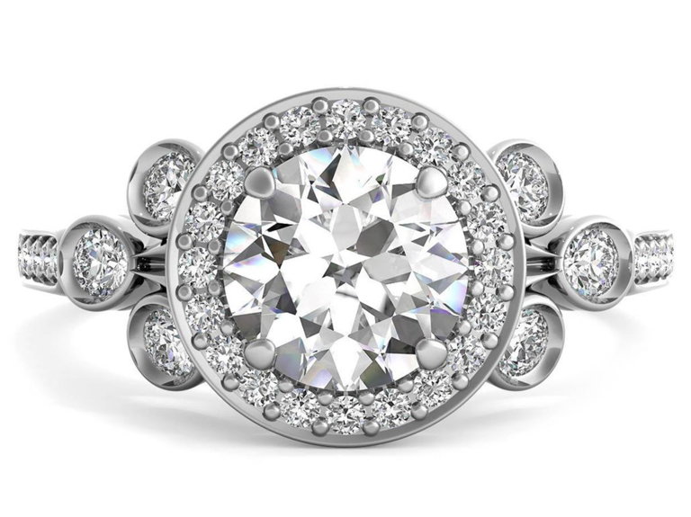 Round center diamond with halo and bezel set diamonds on silver band