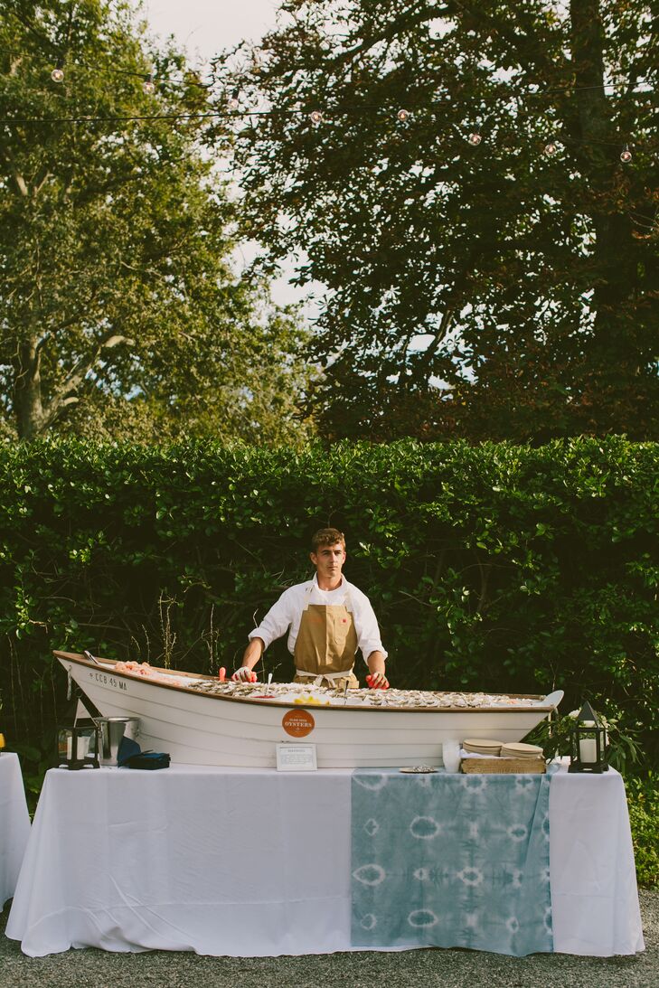 Erin and Tyler kicked off the festivities with a bang, treating guests to a raw bar—served in a rowboat—passed hors d’oeuvres and signature cocktails such as tequila palomas, dark and stormies and cider-bourbon cocktails garnished with a slice of bacon. “Yup, bacon. People still talk about that drink,” Erin says.